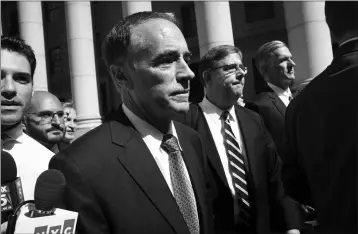  ?? ASSOCIATED PRESS ?? REPUBLICAN U.S. REP. CHRISTOPHE­R COLLINS, center, leaves federal court Wednesday in New York.