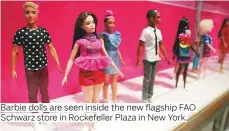  ??  ?? Barbie dolls are seen inside the new flagship FAO Schwarz store in Rockefelle­r Plaza in New York.