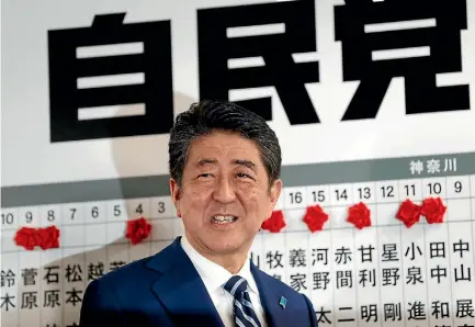  ?? PHOTO: REUTERS ?? Japan’s Prime Minister Shinzo Abe, leader of the Liberal Democratic Party, celebrates his election win at the LDP headquarte­rs in Tokyo.