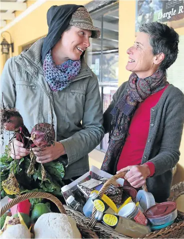 ?? Pictures: Jackie Clausen ?? Sarah Derrett and Nikki Brighton with some bartered goods at the barter market in Dargle.