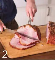  ??  ?? Holding the cushion portion steady with a meat fork, cut it into even slices from the top down.