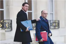  ??  ?? PARIS: French Prime Minister Manuel Valls (left) and French Interior minister Bernard Cazeneuve leaving the weekly cabinet meeting at the Elysee presidenti­al Palace in Paris. French Interior Minister Bernard Cazeneuve was appointed as the new prime...