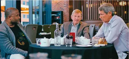  ??  ?? Looking back: John Barnes (left), Kenny Dalglish and Alan Hansen in a still from the film Kenny