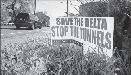  ?? Rich Pedroncell­i Associated Press ?? A SIGN opposing the proposed Sacramento-San Joaquin Delta tunnel plan is displayed in a yard near Freeport, Calif., in 2016.