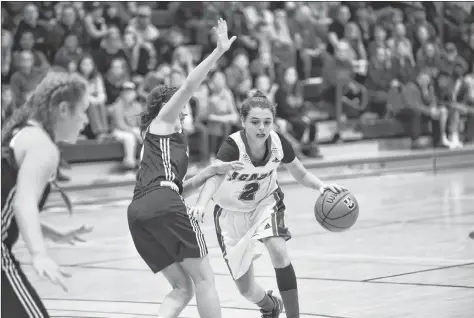  ?? PETER OLESKEVICH PHOTO ?? Port Williams, N.S. native Haley McDonald is guarded closely by X-Woman.