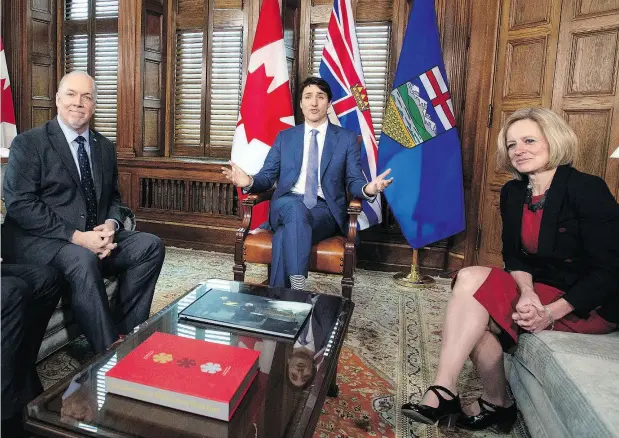  ?? JUSTIN TANG / THE CANADIAN PRESS ?? Prime Minister Justin Trudeau meets with B.C. Premier John Horgan and Alberta Premier Rachel Notley on Sunday in a bid to settle the deadlock over the Trans Mountain pipeline expansion. Trudeau said his government will be “exerting its constituti­onal...