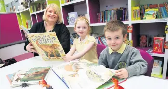  ??  ?? Looking the part Staff and pupils of St Fergus’ Primary in Paisley with their smart school uniforms