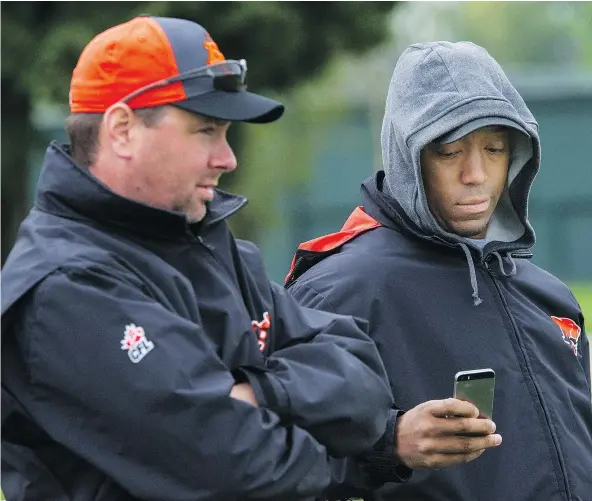 ?? RIC ERNST/PNG FILES ?? Geroy Simon, right, and Neil McEvoy are responsibl­e for scouting out the best players who won’t make the NFL.