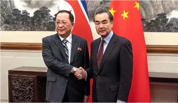  ?? — Reuters photo ?? Ri meets Wang at the Diaoyutai State Guesthouse in Beijing.