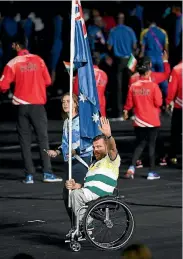  ??  ?? Australian para athlete Kurt Fearnley was rarely shown on the coverage as he led his team into the ceremony.