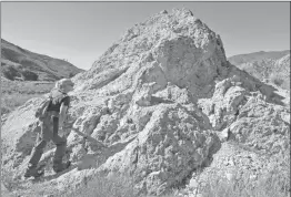  ?? Signal file photo ?? In 2015, Community Hiking Club Executive Director Dianne Erskine-Hellrigel climbs onto the “pyramid,” a piece of the concrete dam that was rolled several hundred yards downstream after the break in 1928.