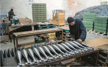  ?? EVGENIY MALOLETKA/AP ?? A worker assembles mortar rounds Jan. 31 at a factory in Ukraine, which has ramped up its output.