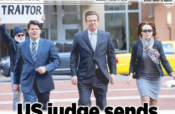  ?? REUTERS ?? Paul Manafort (center), former campaign manager for US President Donald Trump, arrives with his wife Kathleen, for an arraignmen­t at the federal courthouse in a photo taken in March.