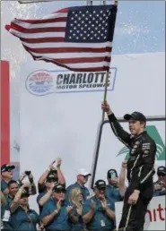  ?? CHUCK BURTON — THE ASSOCIATED PRESS ?? Brad Keselowski celebrates in Victory Lane after winning the NASCAR Xfinity series auto race at Charlotte Motor Speedway in Charlotte, N.C., Saturday.