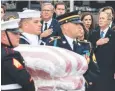  ?? Picture: AFP ?? Former US President George W. Bush and brother Jeb Bush watch as the casket is carried off the train.