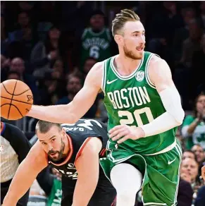  ?? — AFP ?? Mixed fortunes: Boston Celtic beat San Antonio 135-115 in an NBA game on Saturday but their star Gordon Hayward (No. 20) suffered a broken left hand and could be out for at least a month.