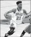  ?? AP/CHARLES REX ARBOGAST ?? After Jimmy Butler of the Minnesota Timberwolv­es gave out his phone number at a news conference Thursday, Michael Byrne of Evanston, Ill., received more than 100 phone calls from fans thinking he was Butler. Butler and Byrne’s phone number differ by...