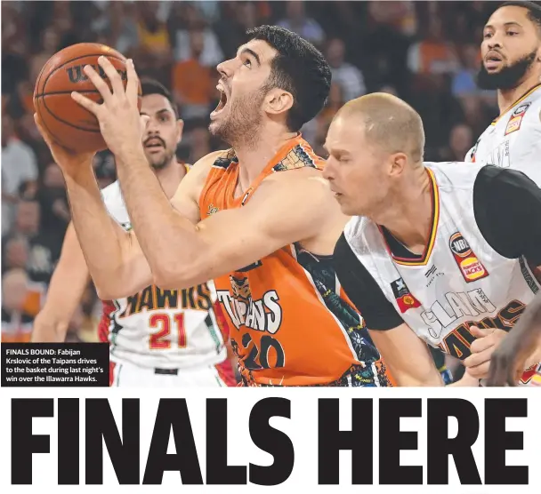  ??  ?? BOUND: Fabijan Krslovic of the Taipans drives to the basket during last night’s win over the Illawarra Hawks.