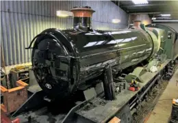  ?? JEFF JACKSON ?? Gloss green paint is now appearing on the boiler of ex-Barry ‘Modified Hall’ No. 6989 Wightwick Hall at the Buckingham­shire Railway Centre, as pictured during March – the engine celebrated its 70th birthday on the 25th of that month. The fictional...