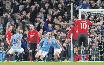  ?? AFP ?? Manchester City’s David Silva, centre, reacts after scoring against Manchester United.