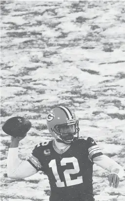  ?? MORRY GASH/AP ?? Packers’ Aaron Rodgers throws during the first half of a game against the Titans on Dec. 27 in Green Bay, Wis.