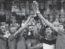 ??  ?? SERBIA players hold up the ATP CUP after defeating Spain during their ATP Cup tennis tournament in Sydney, Monday, Jan. 13, 2020. (AP Photo/Steve Christo)