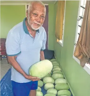  ?? Charles Chambers ?? From left: Fani Cheer with his watermelon­s which he harvested at Karavi on August 22, 2019. Photo: