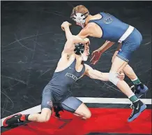  ?? [JOSHUA A. BICKEL/DISPATCH] ?? Ohio State’s Nathan Tomasello tries to takedown Penn State’s George Carpenter during a dual meet Feb. 3. Tomasello said the pressure will be on the defending champion Nittany Lions in the Big Ten tournament this weekend.