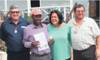  ?? Photo: Supplied ?? From left: Neil Els (Skal Internatio­nal SA president), parking attendant Daniel Ryneveldt (new tourism ambassador), Elmay Bouwer (Knysna Tourism chair), and Andrew Rogers (Skal Garden Route president).