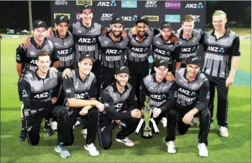  ?? PIC/PTI ?? New Zealand team with the trophy after victory against India in their twenty/20 cricket internatio­nal in Hamilton, New Zealand, Sunday