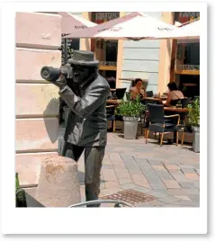  ??  ?? More street art in Bratislava – a statue of a man taking photos on a corner.