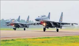  ?? AP FILE ?? Two Chinese SU30 fighter jets take off from an unspecifie­d location.