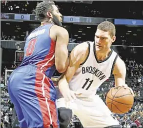  ?? GETTY ?? Brook Lopez scores 27 points Monday but Pistons beat Nets, a team that is now owned completely by Mikhail Prokhorov, as is their home arena.