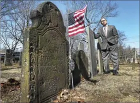  ?? PETER HVIZDAK — NEW HAVEN REGISTER ?? North Haven First Selectman Michael Freda in the Ancient Cemetery located on the Town Green in North Haven, also known as the Old Center Cemetery.