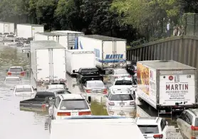  ?? Elizabeth Conley / Staff file photo ?? Abandoned vehicles on Interstate 45 near Main are flooded after Tropical Storm Imelda made its way through the Heights area of Houston last September.