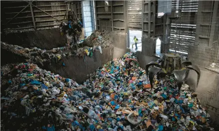  ?? ODED BALILTY/AP ?? Waste largely made up of plastic is gathered Jan. 25 at a recycling plant near Jerusalem. Israel’s tax on single-use plastic items may end soon.