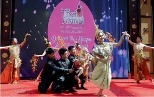  ??  ?? Artists perform traditiona­l dance during the Thai Festival at the Yas Mall in Abu Dhabi.