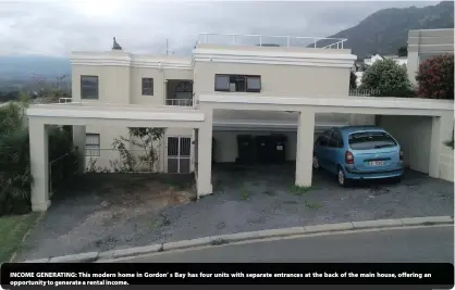  ??  ?? INCOME GENERATING: This modern home in Gordon’ s Bay has four units with separate entrances at the back of the main house, offering an opportunit­y to generate a rental income.