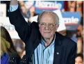  ?? Reuters ?? Sanders lifts his fist at a campaign rally in San Antonio. —