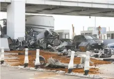  ?? Paul Chinn / The Chronicle ?? Four Bay Bridge tollbooths remain out of commission after a truck crashed into one Saturday, killing a toll collector.