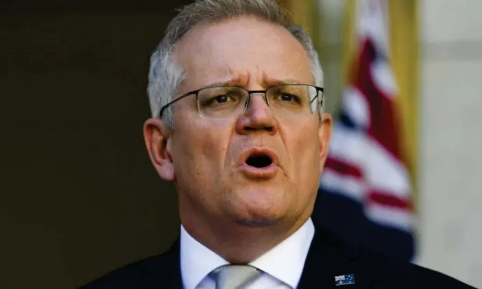  ?? Photograph: Lukas Coch/AAP ?? Scott Morrison has spoken to his Coalition colleagues about loyalty and unity in a party room meeting to mark three years as prime minister.