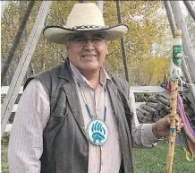  ??  ?? Chief Wallace Fox of the Onion Lake Cree Nation created the walking stick that will be transferre­d between host universiti­es of a national forum on reconcilia­tion in post-secondary education.