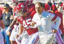  ?? VASHA HUNT/AP ?? Alabama coach Nick Saban and the Crimson Tide are among the top teams coming to Orlando for bowl games.