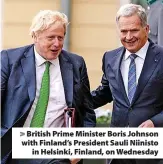  ?? ?? > British Prime Minister Boris Johnson with Finland’s President Sauli Niinisto in Helsinki, Finland, on Wednesday