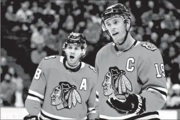  ?? CHRIS SWEDA/CHICAGO TRIBUNE ?? Patrick Kane, right, and Jonathan Toews were seemingly out of playoff contention until NHL’s expansion of the playoffs.