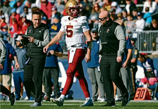  ?? JESSICA HILL/HARTFORD COURANT VIA AP ?? BC quarterbac­k Phil Jurkovec threw a pair of intercepti­ons before leaving with an apparent knee injury in the third quarter.