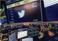  ?? Seth Wenig/Associated Press ?? The symbol for Twitter appears Tuesday on a monitor above a trading station on the floor of the New York Stock Exchange.