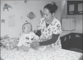  ?? LYN GOULD FOR CHINA DAILY ?? Sophie, a cancer patient who died last year, with a pediatric nurse at the Butterfly Home.