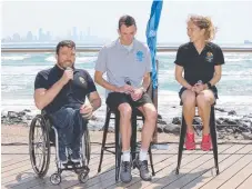  ??  ?? Marathoner­s Kurt Fearnley, Michael Shelley and Jess Trengove.