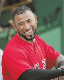  ?? STAFF PHOTO BY JOHN WILCOX ?? PENCIL HIM IN: Eduardo Nunez smiles in the dugout before making his Red Sox debut as the designated hitter against the Royals last night at Fenway.